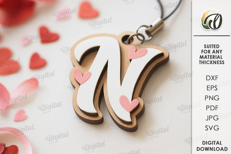 May include: Wooden letter "N" pendant with a white top layer and brown base, adorned with pink hearts. The pendant is attached to a black cord. The image also includes scattered red heart shapes and the text "SUITED FOR ANY MATERIAL THICKNESS".