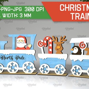 May include: A Christmas train with four cars, each decorated with a different holiday theme. The first car features Santa Claus, the second car has a candy cane and reindeer, the third car has a penguin and a gingerbread man, and the fourth car says "North Pole".