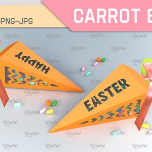 Pode incluir: Duas caixas de cor laranja em forma de cenoura com janelas recortadas e as palavras "Happy" e "Easter" nelas. As caixas est&atilde;o cheias de doces coloridos e t&ecirc;m topos verdes com fitas cor-de-rosa.