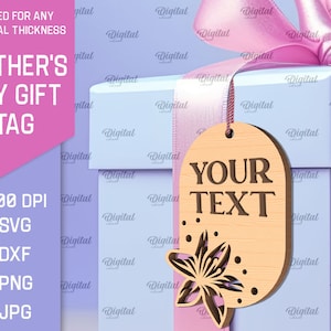 May include: A light blue gift box with a pink ribbon and a wooden tag that says "YOUR TEXT". The tag has a floral design and is perfect for a Mother's Day gift.