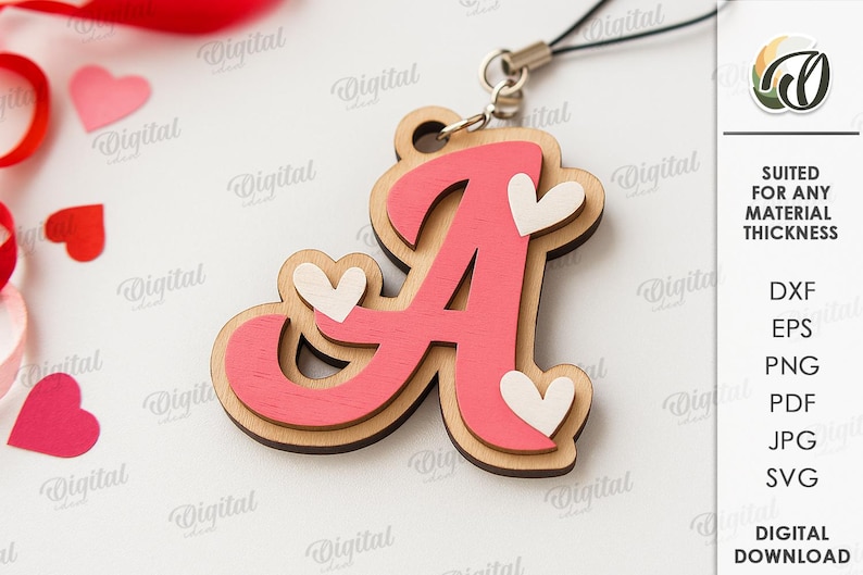 May include: A wooden pendant in the shape of the letter "A", painted pink with a light brown border. The pendant has three small white heart accents. A black cord is attached to the top. The background includes red and pink heart-shaped confetti.
