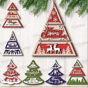 May include: A selection of ten Christmas tree decorations in red, green, and blue. Each ornament has festive text such as "Merry Christmas" and "Season's Greetings." The designs are suitable for any material thickness and are available as a digital download.
