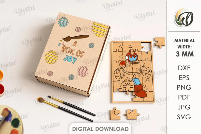 May include: A wooden puzzle and box set. The box is light brown with colourful circles and the text "A BOX OF JOY". The puzzle is a robot design. The material width is 3 mm.