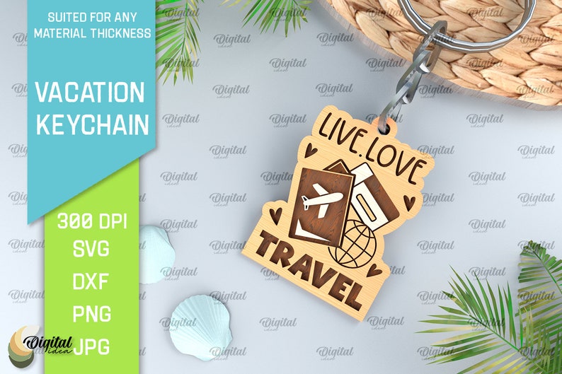 May include: A wooden keychain with the text "Live. Love. Travel" and a design of a passport, airplane, and globe. The keychain is attached to a silver key ring.