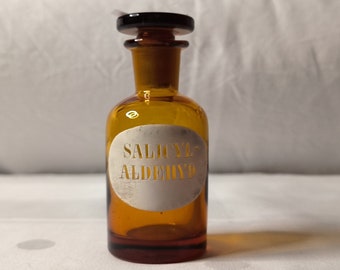 Bottiglia da farmacia "Sailcyl Aldehyde" del 1900 con coperchio in vetro smaltato