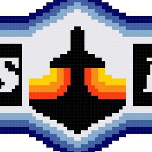 Op de afbeelding: Een blauw en wit gepixeld logo met de tekst "JETS" links, "LAG" rechts en een gepixeld vliegtuig in het midden. De tekst boven het logo luidt "THAT'S JUST HOW THE".