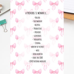 May include: A white printable featuring the text "BIBLE PRINTABLES" at the top. The text "A PROVERBS 31 WOMAN IS..." is followed by a list of positive attributes. Pink watercolor bows decorate the background. The bottom text reads "PDF-3SIZES".