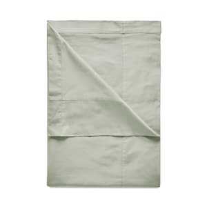 May include: A light green flat sheet with a folded edge. The sheet is made of a soft, smooth fabric.