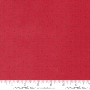 May include: Red fabric with a small, white polka dot pattern. The fabric is shown with a ruler measuring 7 inches.