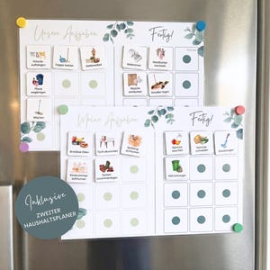 May include: Two white magnetic chore charts with eucalyptus leaf accents and grid layouts. The charts feature German text including Unsere Aufgaben, Meine Aufgaben, and Fertig, with various task icons and small colored magnets attached to the surface.