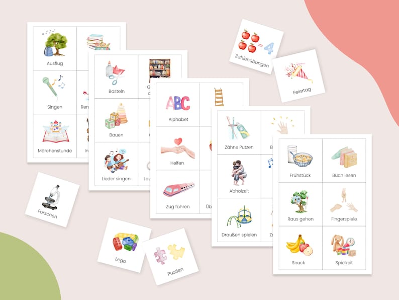 May include: A set of colorful cards with illustrations and German words for activities, such as "Ausflug" (outing), "Singen" (singing), "Bauen" (building), "M&auml;rchenstunde" (story time), "Forschen" (research), "Lieder singen" (singing songs), "Lego", "Puzzlen" (puzzling), "Zahlen&uuml;bungen" (number exercises), "Feiertag" (holiday), "Z&auml;hne Putzen" (brushing teeth), "Helfen" (helping), "Fr&uuml;hst&uuml;ck" (breakfast), "Buch lesen" (reading a book), "Abholzeit" (pick-up time), "Zug fahren" (taking a train), "Drau&szlig;en spielen" (playing outside), "Raus gehen" (going out), "Fingerspiele" (finger games), "Snack", "Spielzeit" (playtime), and "Alphabet".
