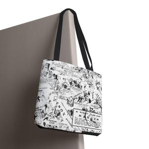 May include: A black and white tote bag with a map of Harlem, New York City. The map features various businesses and landmarks, including the "Radium Club", "Lenox Avenue", and "The Theatrical Grill". The text "A Night Club Map of Harlem" is printed on the bag.