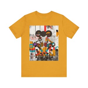 Black Girl Roller Skaters Tee Shirt featuring abstract graffiti pop art of African American women roller skating in bold, bright colors; Afrocentric fly girls streetwear.