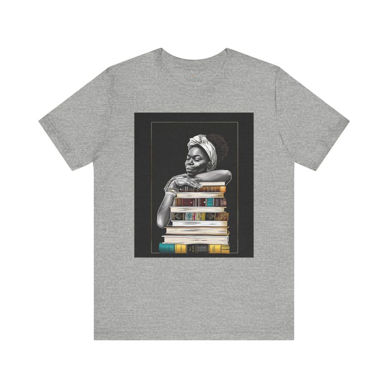 Afrocentric graphic tee shirt featuring a peaceful Black woman embracing a stack of books, symbolizing education, knowledge, freedom, and generational legacy.