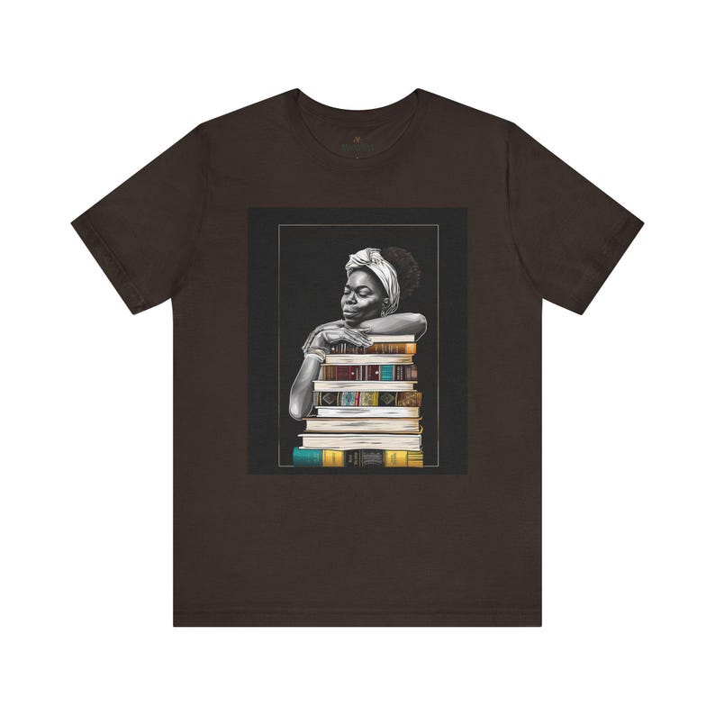 Afrocentric graphic tee shirt featuring a peaceful Black woman embracing a stack of books, symbolizing education, knowledge, freedom, and generational legacy.