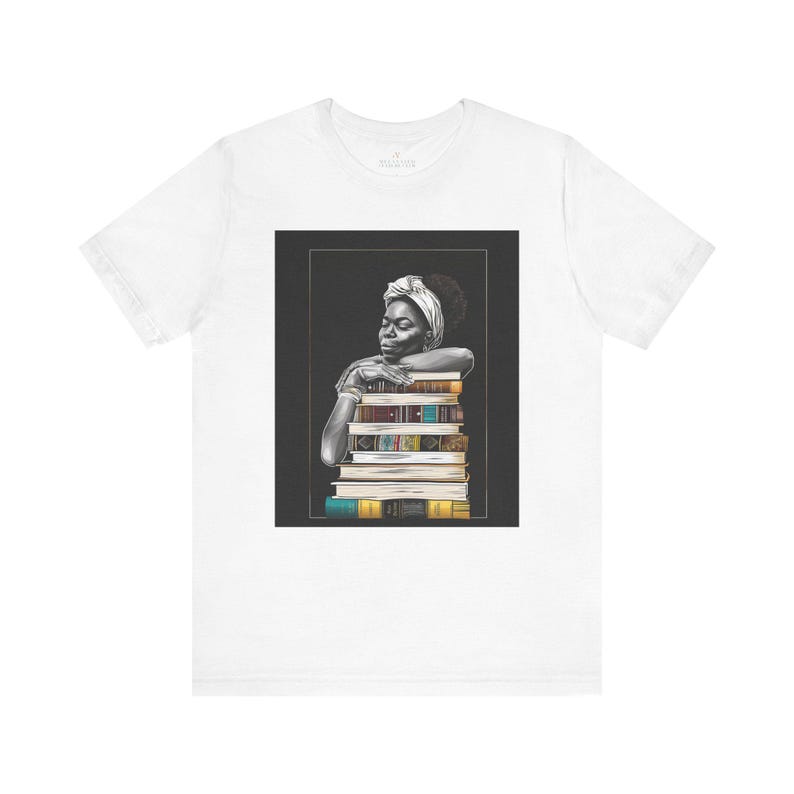 Afrocentric graphic tee shirt featuring a peaceful Black woman embracing a stack of books, symbolizing education, knowledge, freedom, and generational legacy.