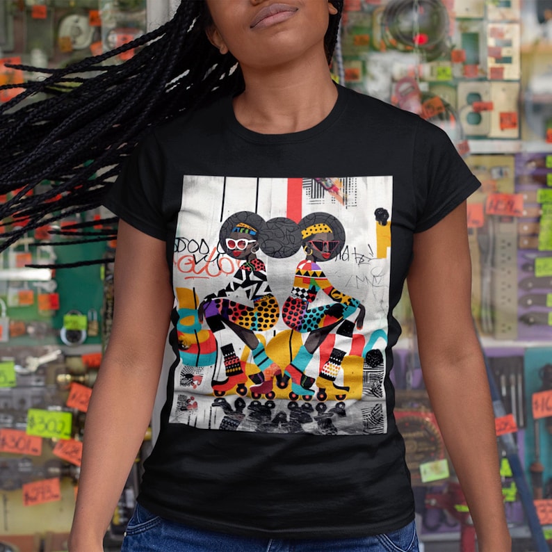 Black Girl Roller Skaters Tee Shirt featuring abstract graffiti pop art of African American women roller skating in bold, bright colors; Afrocentric fly girls streetwear.