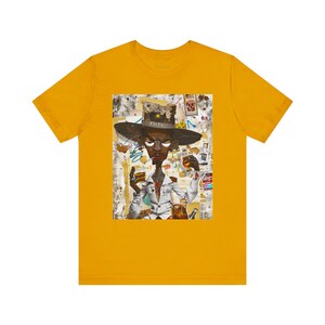 Black Cowboy Tee featuring a cartoon-style African American cowboy smoking a cigarette and drinking whiskey. A bold, graffiti collage pop art design with an edgy Western and Afrocentric cultural vibe.