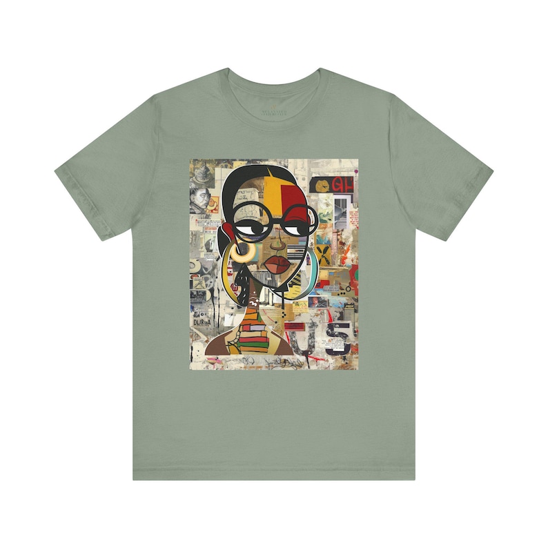 Boss Babe graphic tee featuring an abstract cartoon-style Black woman with large round black eyeglasses. The design has a vibrant, graffiti-inspired aesthetic that celebrates African American beauty, confidence, and urban art style.