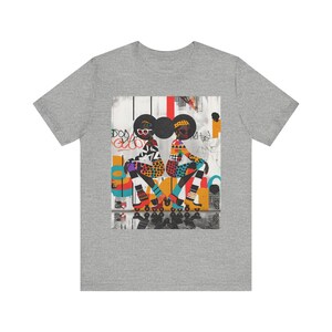 Black Girl Roller Skaters Tee Shirt featuring abstract graffiti pop art of African American women roller skating in bold, bright colors; Afrocentric fly girls streetwear.