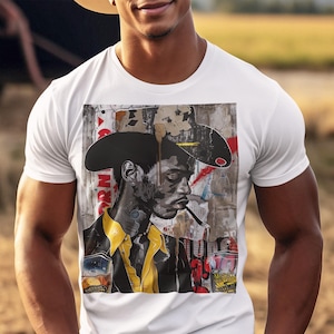May include: A white t-shirt with a colorful graphic print of a man wearing a cowboy hat and holding a glass of liquid. The graphic is a collage of different textures and patterns.