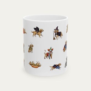 May include: A white ceramic mug featuring a repeating pattern of small watercolour illustrations of dogs in various Halloween costumes, including a bat, a witch with a broom, a bee, a clown, a hot dog, and a superhero cape, all on a plain white background.