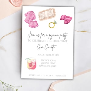 May include: A white invitation card with watercolor illustrations for a pajama party. The card features images of pajamas, slippers, a ring, and a cocktail. Text on the card reads "Join us for a pajama party" and details for the event.