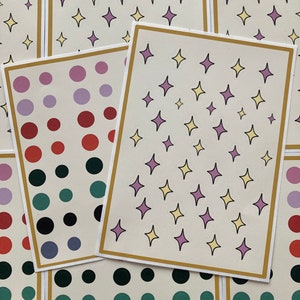 Estrellas y puntos: lindas hojas de pegatinas para diario, mate. Contiene 41 estrellas rosadas y amarillas o 48 puntos rosados, rojos, verdes, negros y grises.