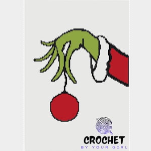 May include: A pixelated image of a green hand holding a red ornament. The hand is wearing a white cuff and a red sleeve. The text "CROCHET BY YOUR GIRL" is at the bottom, with a yarn ball graphic.