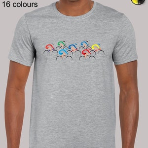 May include: A gray t-shirt with a graphic of a group of cyclists in various colors, including red, yellow, blue, and green. The text "Sizes: S - 5XL 16 colours" is printed above the graphic.