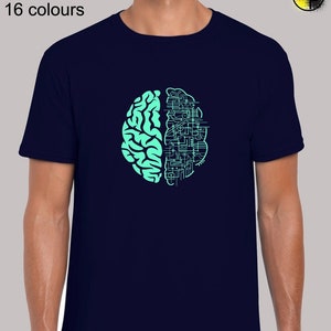 May include: A navy blue t-shirt featuring a teal green graphic of a brain with one half replaced by a circuit board design. The text "Sizes: S - 5XL 16 colours" is at the top of the image.