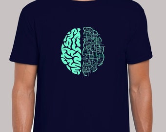 May include: A navy blue t-shirt featuring a teal green graphic of a brain with one half replaced by a circuit board design. The text "Sizes: S - 5XL 16 colours" is at the top of the image.