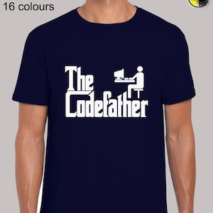 May include: A navy blue t-shirt with a white graphic that says "The Codefather" with a stick figure sitting at a computer.