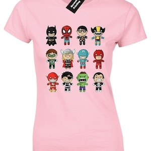 May include: Pink t-shirt featuring a graphic print of various cartoon superheroes, including Batman, Spiderman, Wolverine, and more.