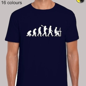May include: A navy blue t-shirt featuring a white graphic of the evolution of man, culminating in a man sitting at a computer. The text "Sizes: S - 5XL 16 colours" is printed on the shirt.