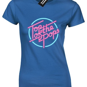 May include: A royal blue t-shirt featuring a pink and blue neon sign graphic that reads "Top of the Pops".