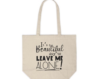 Może przedstawiać: Beżowa torba typu tote z płótna z czarnym tekstem, który brzmi "It's a beautiful day to leave me alone!"