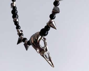 Handmade necklace with black beads and raven skull