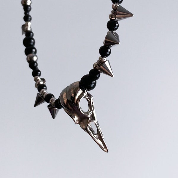 Handmade necklace with black beads and raven skull