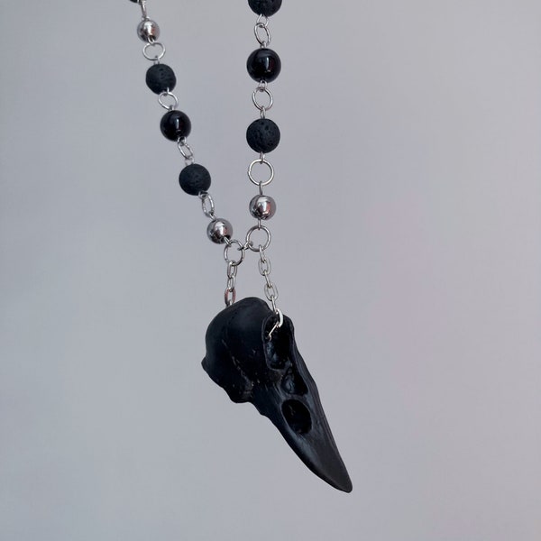 Long handmade necklace with black beads and skull