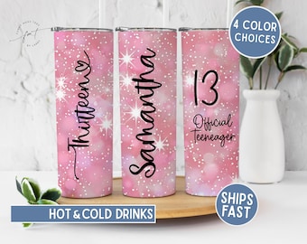 May include: Pink insulated tumblers with glitter and starburst designs. One tumbler says "Thirteen", another says "Samantha", and the third says "13 Official Teenager". The tumblers are for hot and cold drinks.
