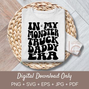May include: A white t-shirt with black text that reads "IN MY MONSTER TRUCK DADDY ERA". The text is in a retro font style.