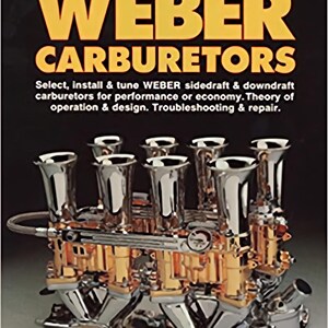 May include: A book cover with the title "WEBER CARBURETORS" in large yellow letters. The cover features a detailed image of a carburetor with chrome and gold components. The text below describes the book's content, including installation, tuning, and troubleshooting. The author's name is Pat Braden.