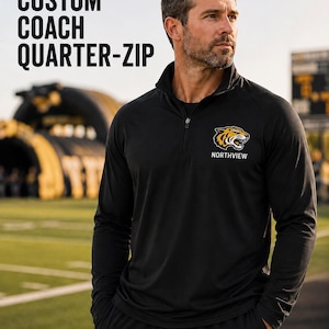 May include: A black long-sleeve quarter-zip pullover featuring a tiger head graphic and the text NORTHVIEW on the left chest. The text CUSTOM COACH QUARTER-ZIP is displayed in the upper left corner of the image.