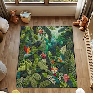 May include: A green, brown, and orange area rug with a jungle theme. The rug features a variety of leaves, flowers, and birds.