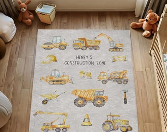 May include: A gray and yellow construction zone play rug with a variety of construction vehicles, tools, and a sign that reads "Henry's Construction Zone".