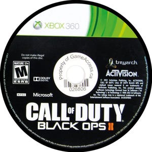 May include: A black Xbox 360 game disc for "Call of Duty: Black Ops II." The disc features the Xbox 360 logo, ESRB rating, and the Activision and Treyarch logos. The disc also has the text "Do not make illegal copies of this disc."