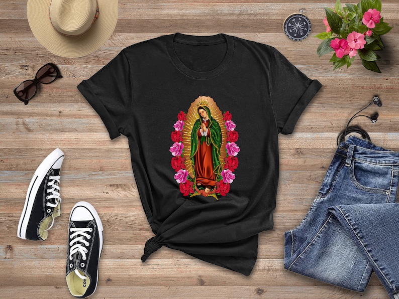 May include: Black t-shirt with a graphic print of the Virgin Mary surrounded by pink and red roses.