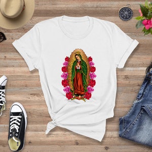 May include: White t-shirt with a graphic of the Virgin Mary surrounded by pink and red roses.