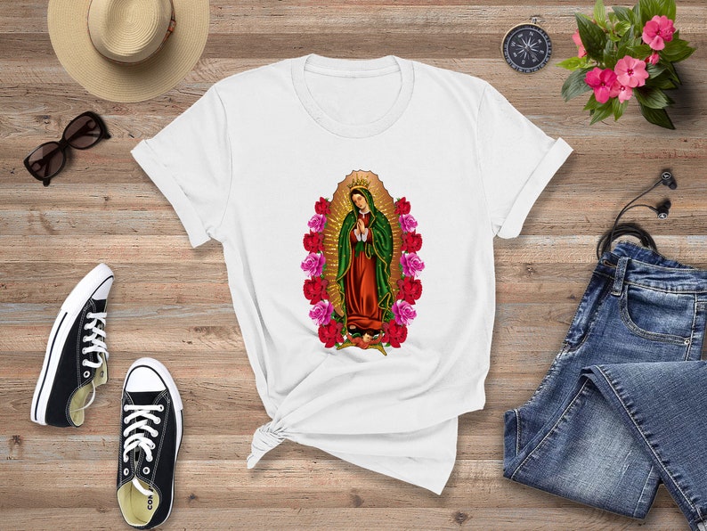 May include: White t-shirt with a graphic of the Virgin Mary surrounded by pink and red roses.